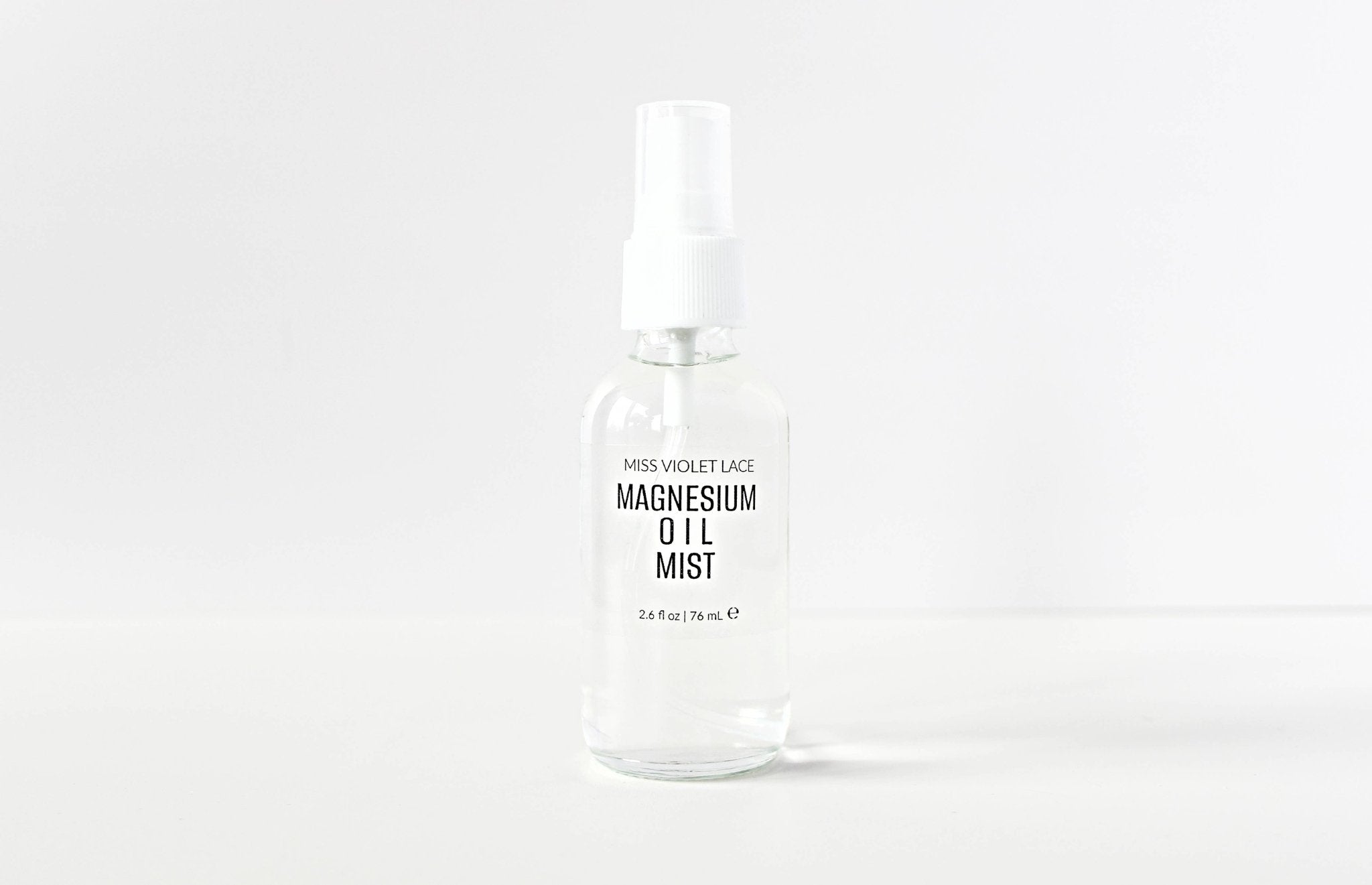 Miss Violet Lace Magnesium Oil Mist in a clear 2.6 fl oz (76 mL) spray bottle