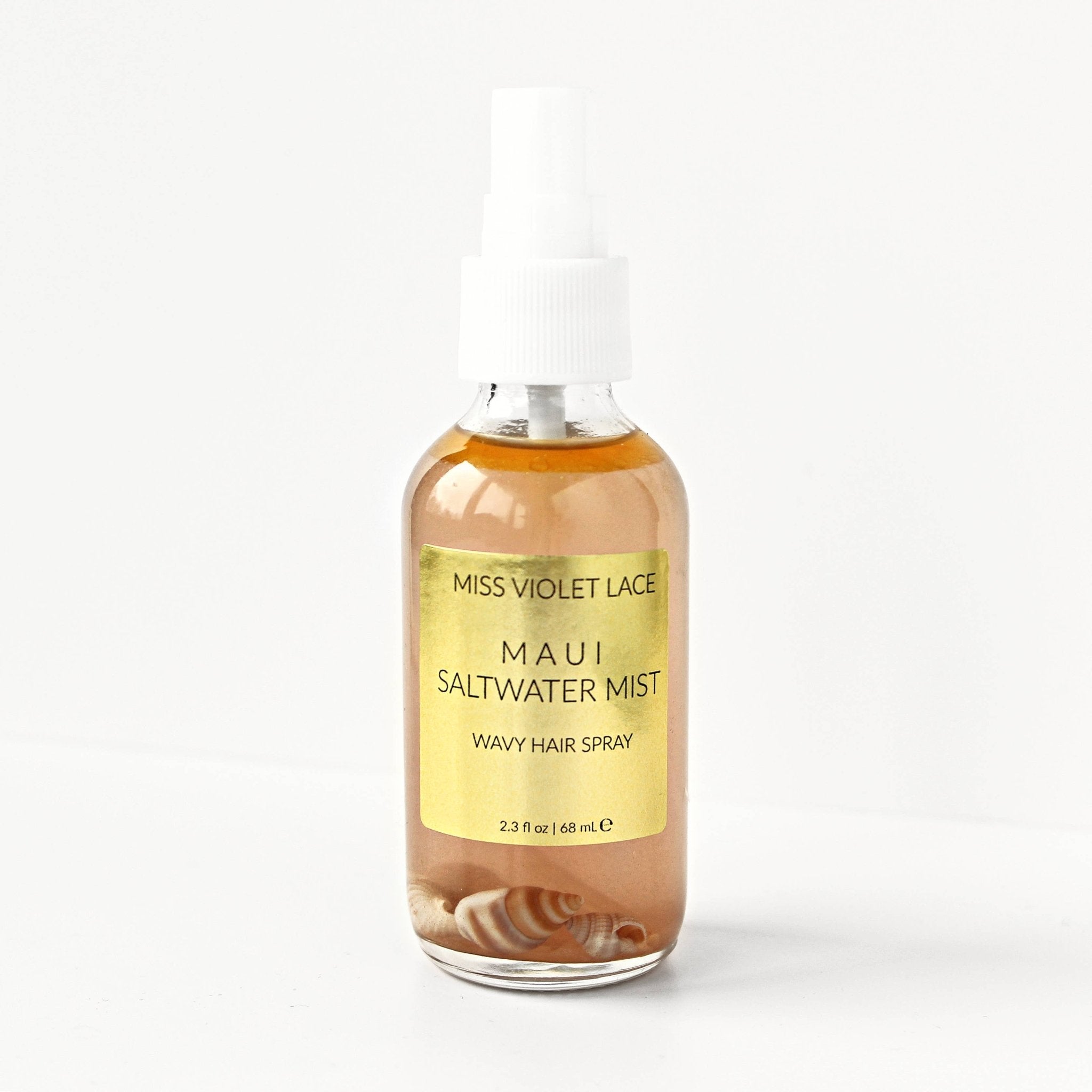 Miss Violet Lace Maui Saltwater Mist Wavy Hair Spray, 2.3 fl oz, in a clear bottle with seashells