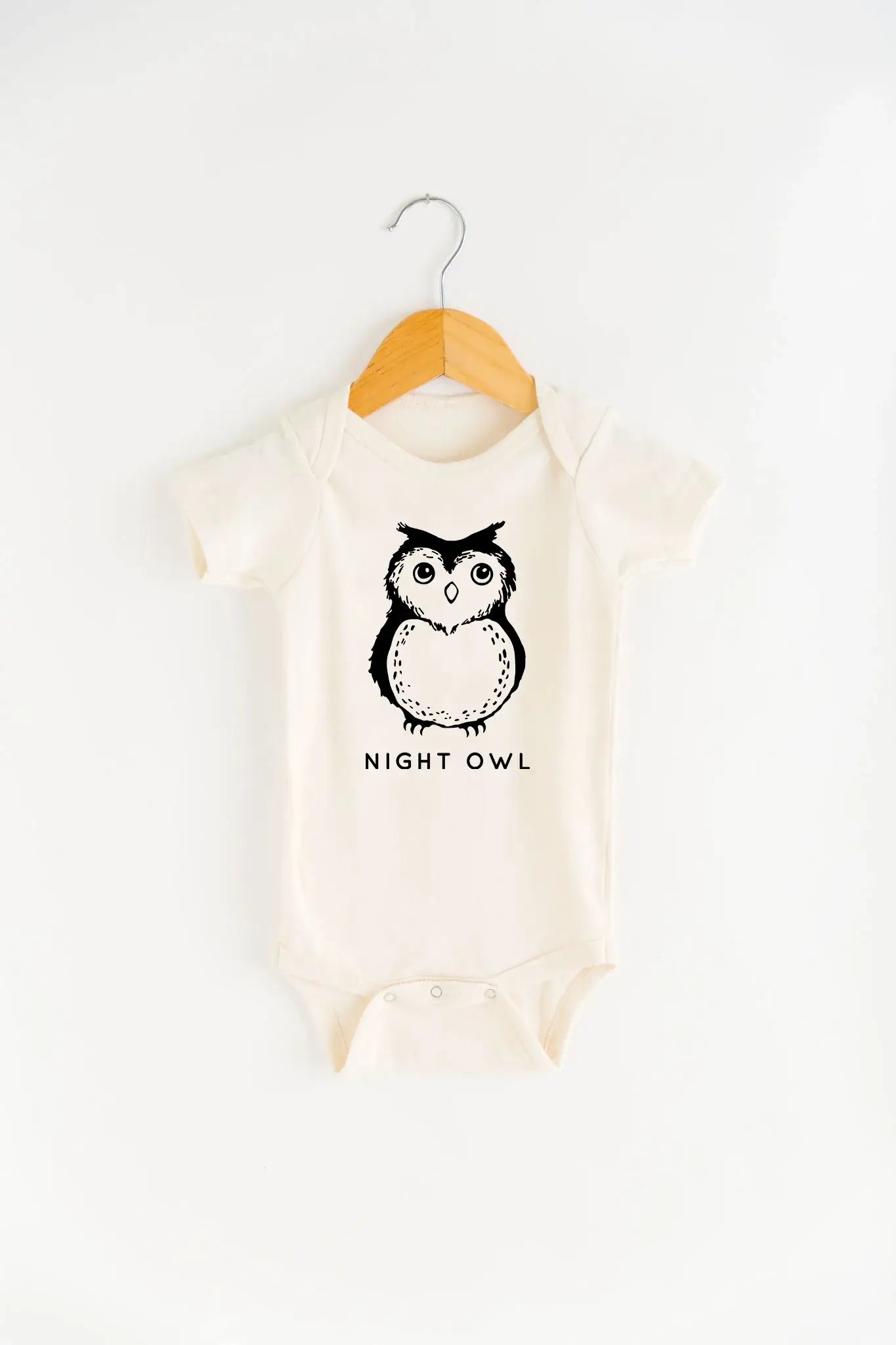 Baby onesie with owl design and 'NIGHT OWL' text on a white background