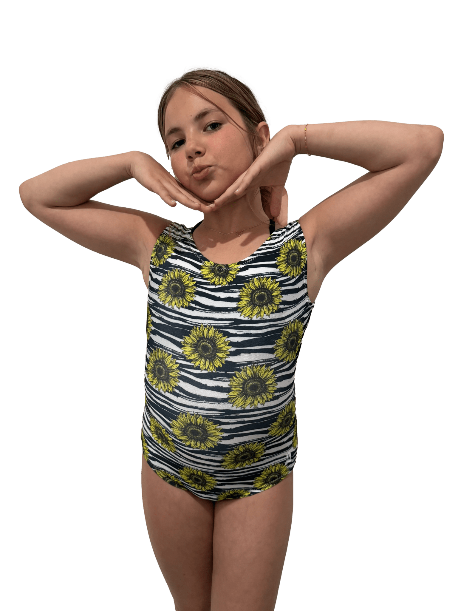 Girl wearing a black and yellow patterned leotard with large sunflowers on a white background