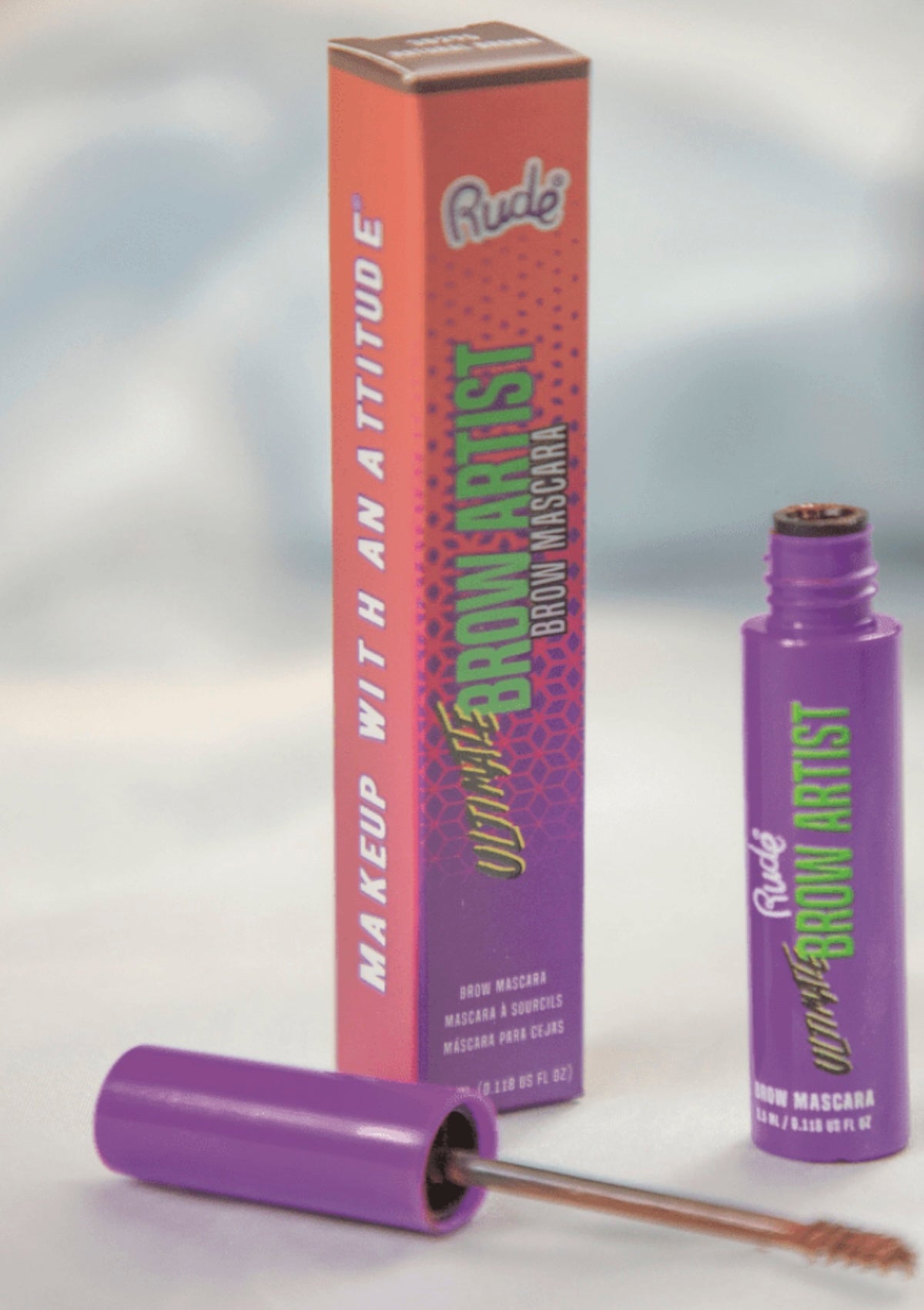 brow mascara with packaging on a reflective surface