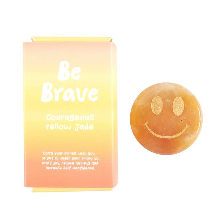 Yellow Jade smiley stone with box reading 'Be Brave'.