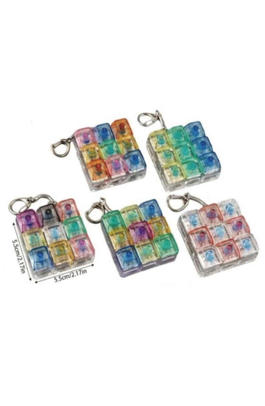 Four small square keychain charms made of clear resin with embedded multicolored cube-like pieces, each attached to a silver metal clasp. Two charms show printed numbers, and one charm has measurement markings.