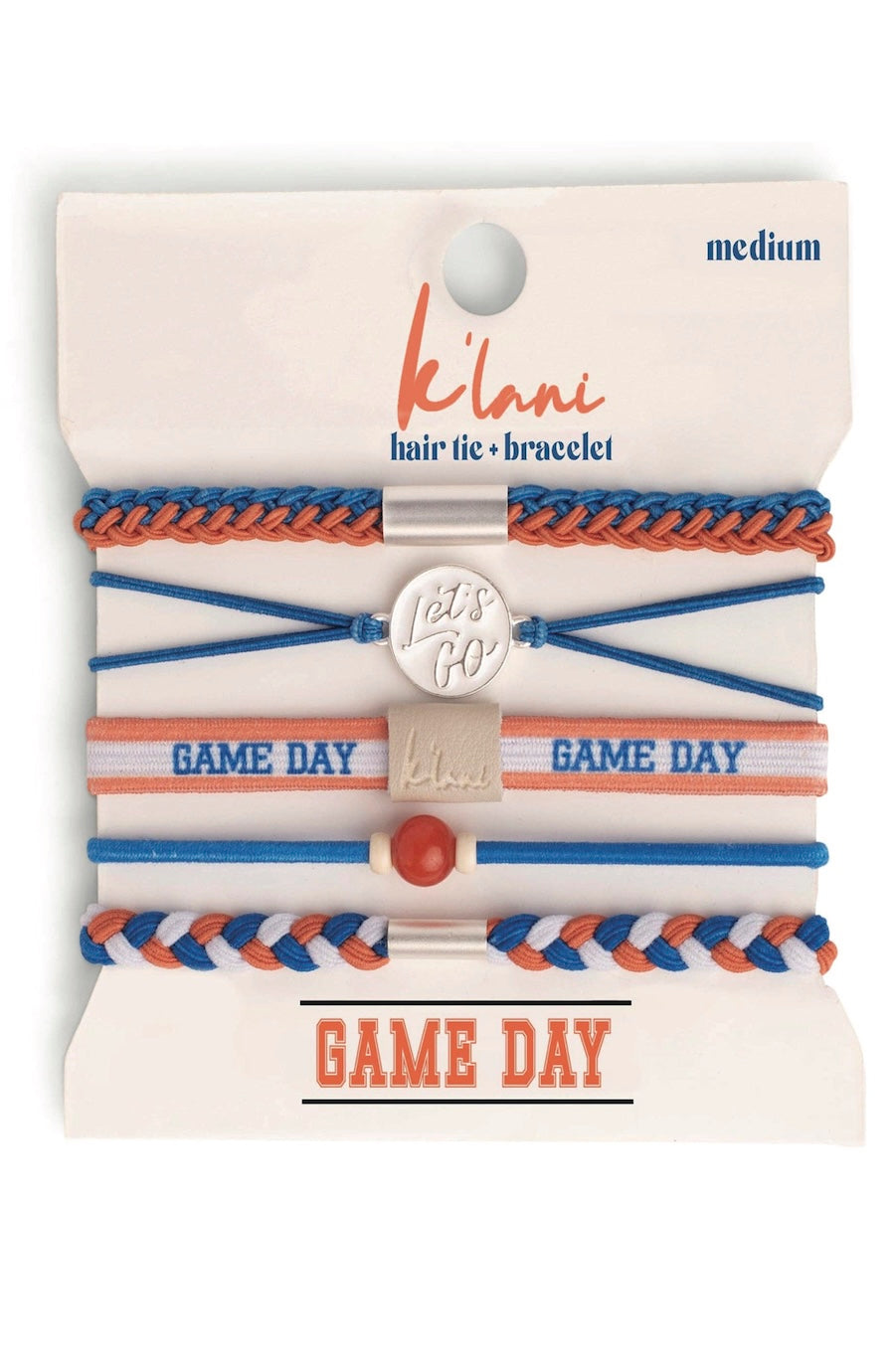 A set of five K'ani 'Game Day' hair tie and bracelet accessories on a white backing card. The set includes braided and elastic bands in blue, orange, and white, with a silver metal charm and a small red bead.