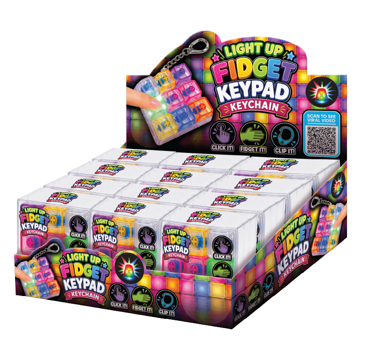 A retail display box filled with multiple small packages of Light Up Fidget Keypad Keychain. The packaging is brightly colored with neon patterns and text, and a hand is shown holding one of the keychains in the upper left area.