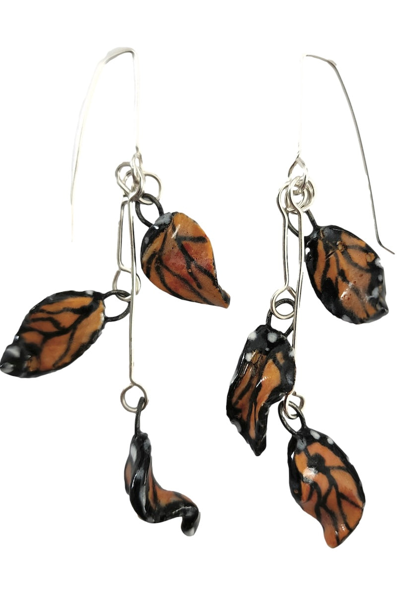 Butterfly wing earrings on a white background