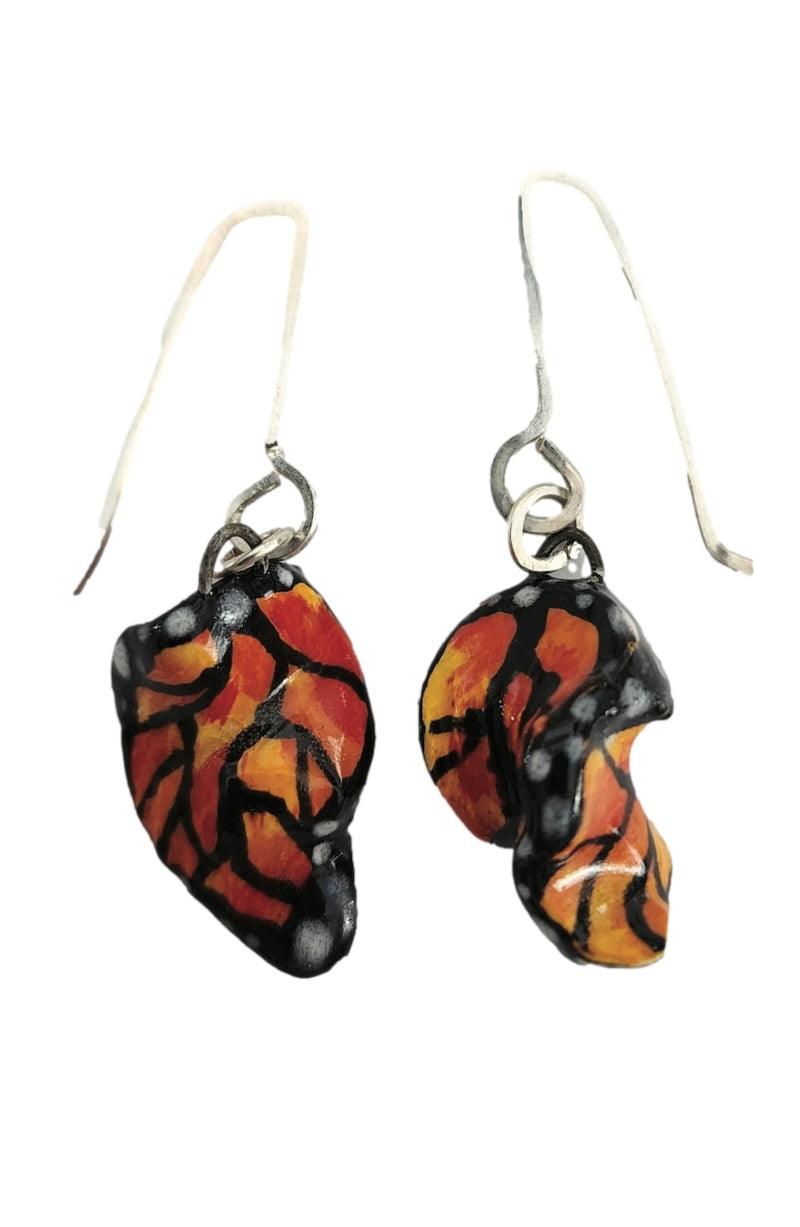 Butterfly wing-shaped earrings on a white background