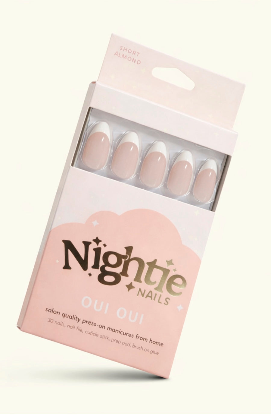 Nightie Nails Oui Oui press-on manicure set in a light pink and white box, showing five almond-shaped nails with a nude-pink and white ombre design.