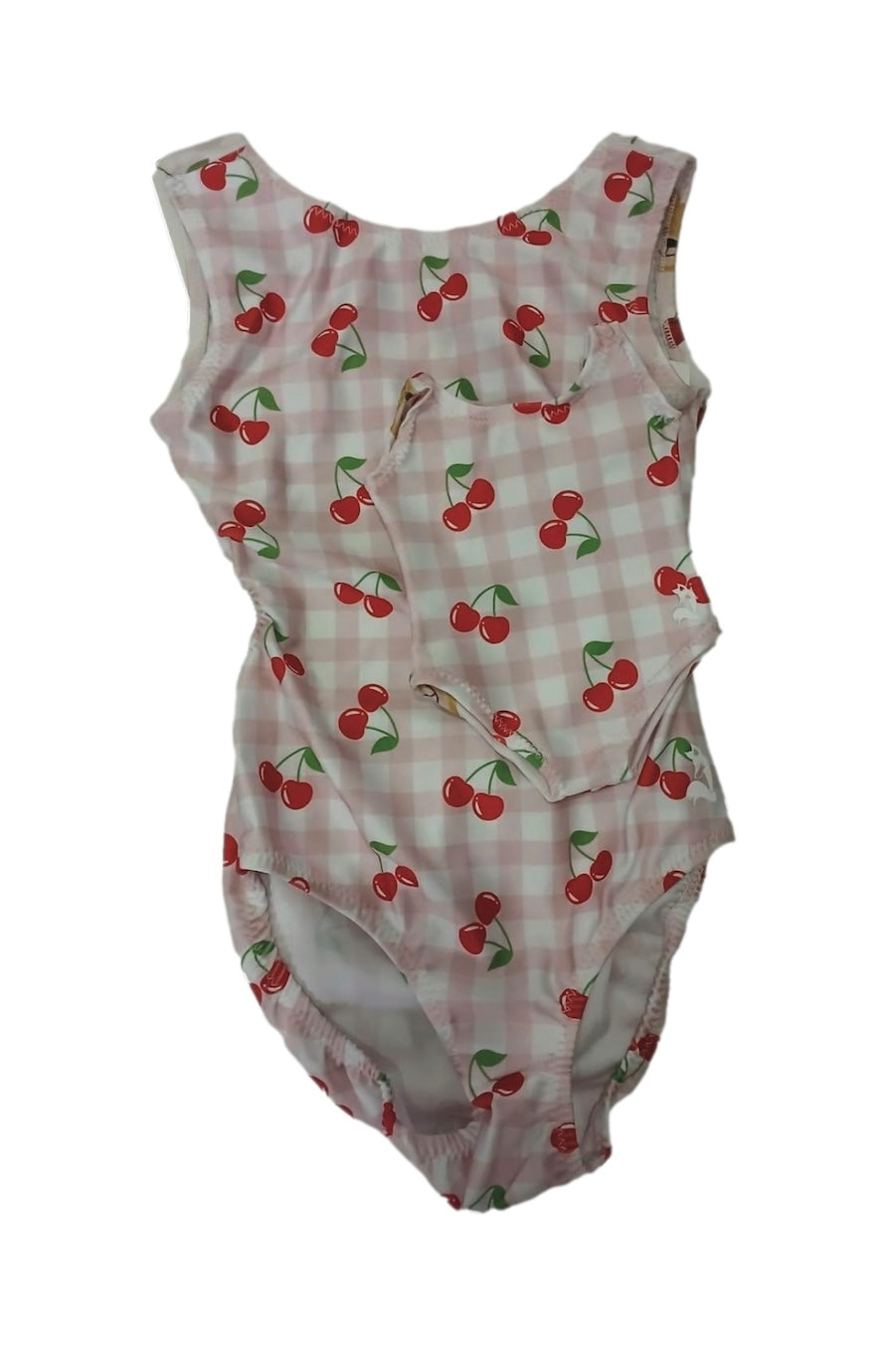 A sleeveless girls gymnastics leotard featuring a pink and white gingham check pattern with a red cherry print, displayed against a plain white background.