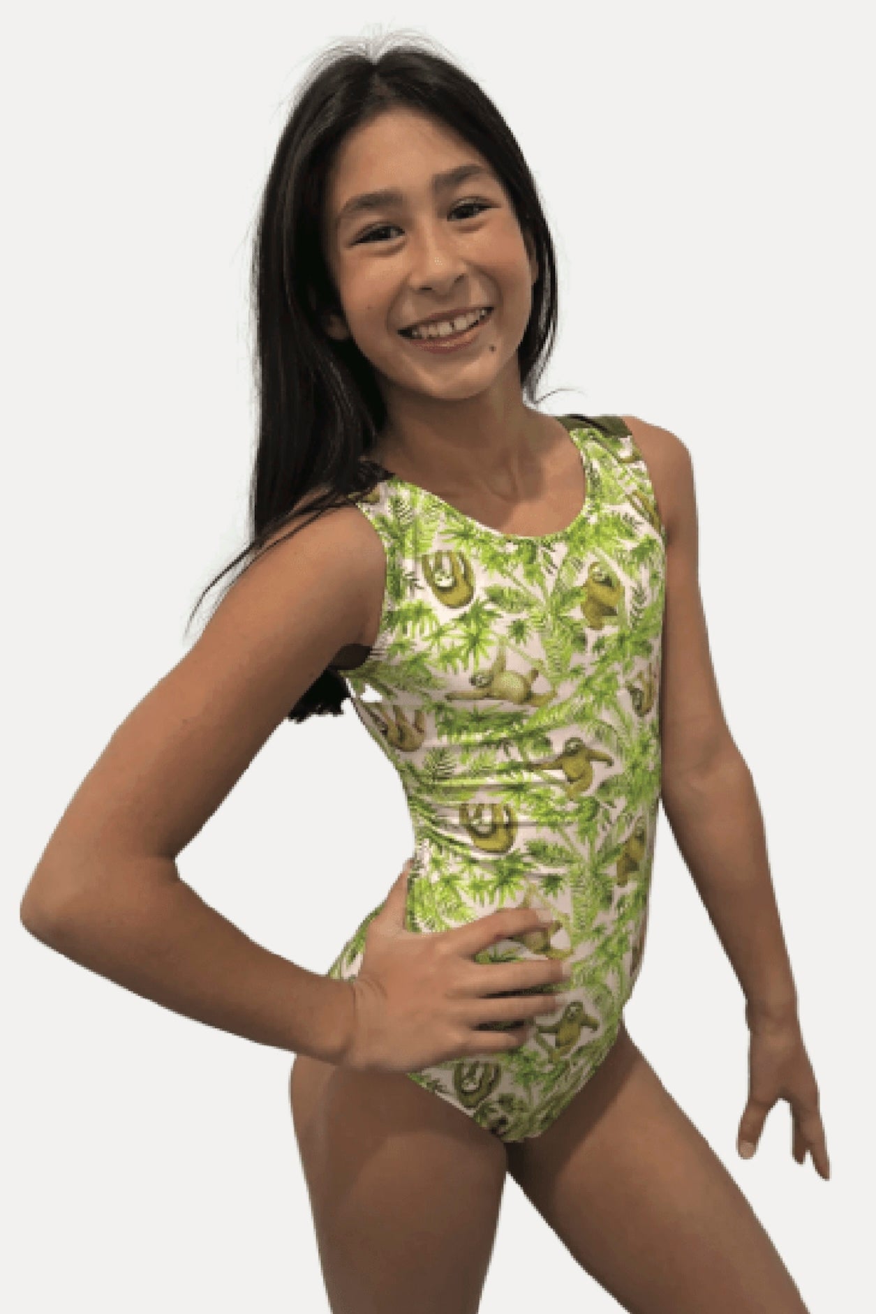 Girl wearing a green and white patterned leotard with soths on a white background